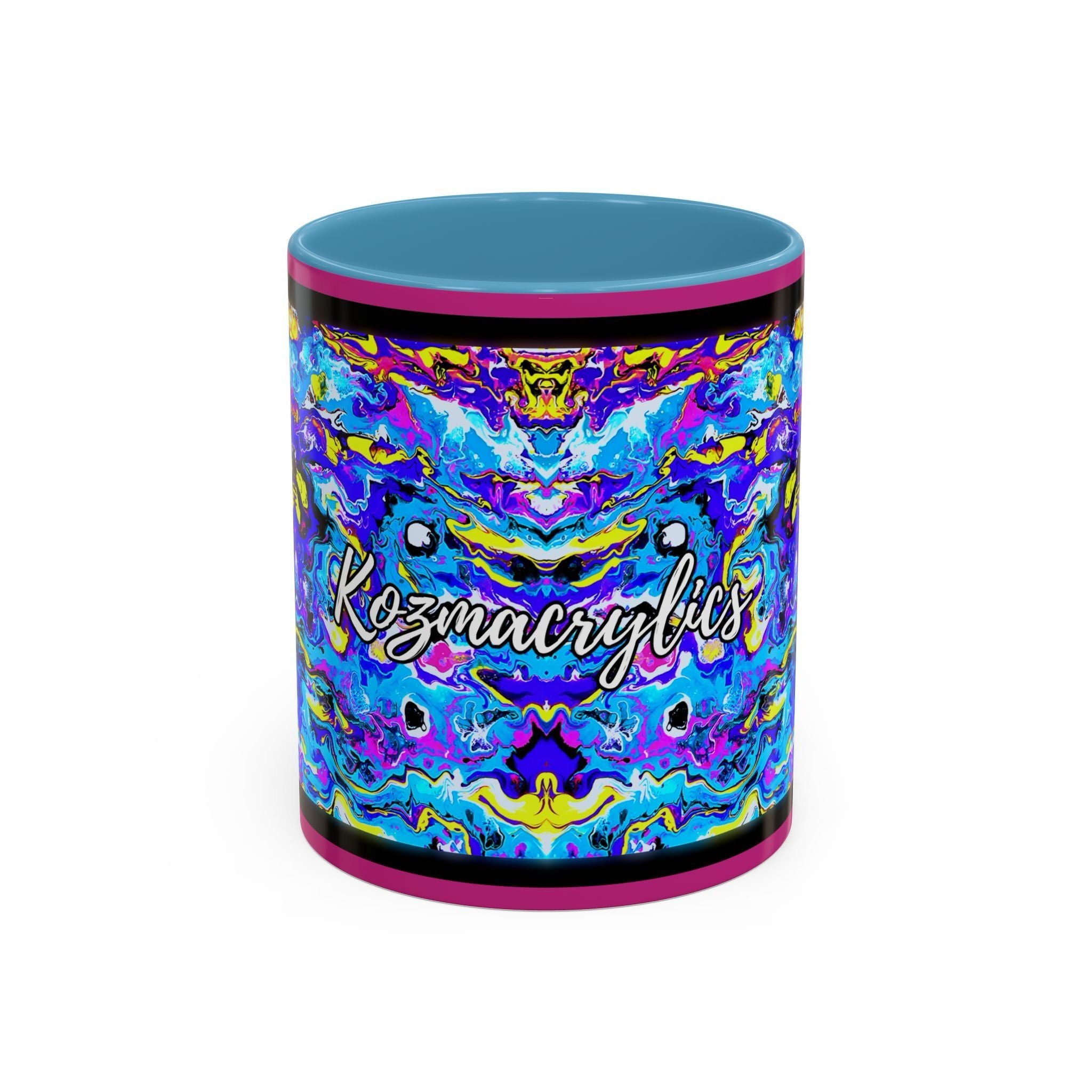 A colorful 15oz ceramic coffee mug with abstract acrylic artwork featuring electric blue, sunburst yellow, radiant violet, and nebula pinks. The handle and interior are blue, matching the wraparound design.